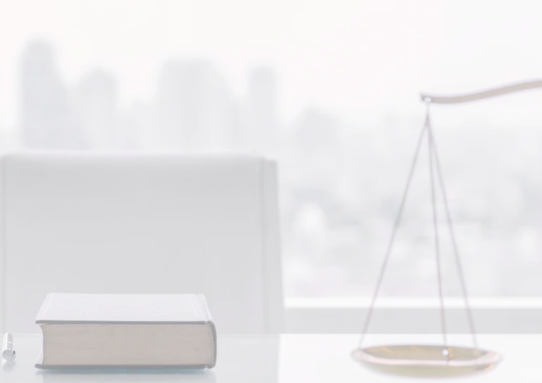 A book and pen on a table
