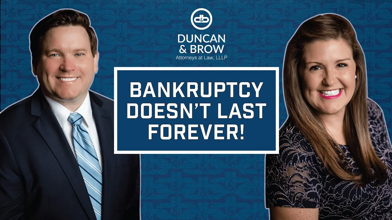 A man and woman posing for a picture