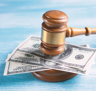 A gavel on top of money