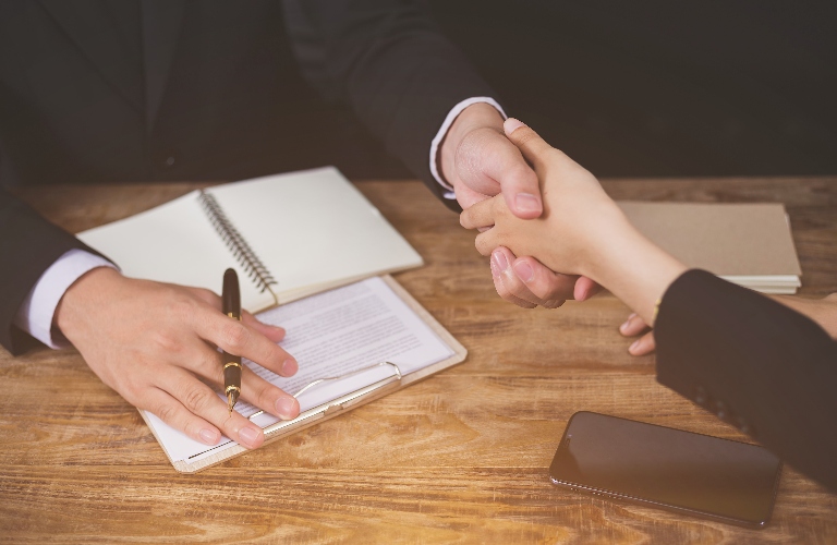 lawyer is shaking hand with the client