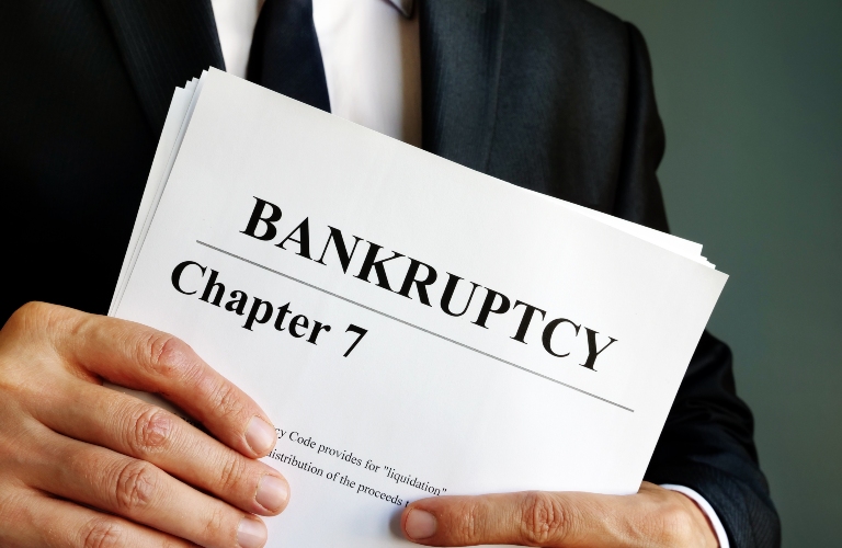 Bankruptcy Chapter 7 documents in the hands of a man