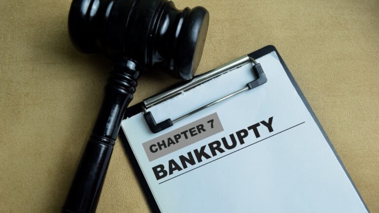 Chapter 7 Bankrupty write on paperwork isolated on wooden background